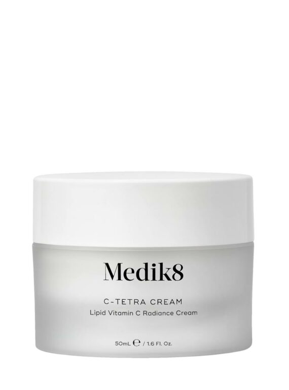 A white jar of Medik8 cream with minimalist labeling.