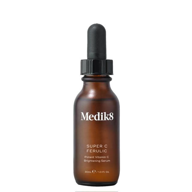 Brown dropper bottle labeled Medliks for skincare.