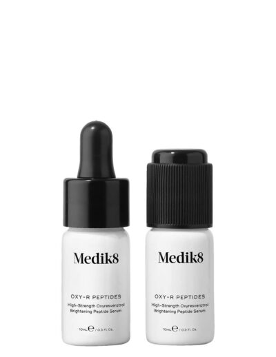 Two small white bottles labeled Medik8 with droppers and caps.
