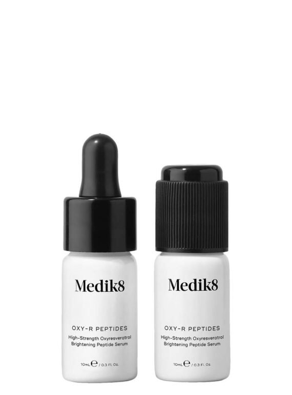 Two small white bottles labeled Medik8 with droppers and caps.