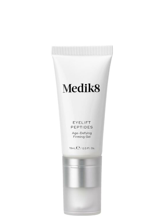 A white tube of Medik8 skincare product with silver cap.