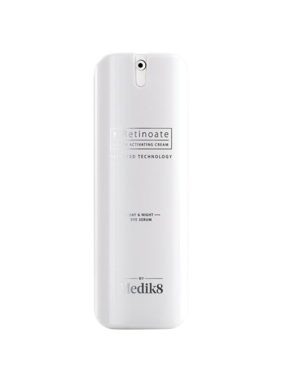 Back view of a white remote control with buttons and text.