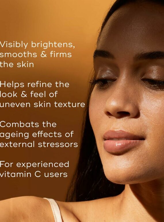 Close-up of a woman with smooth, radiant skin and eyes closed.