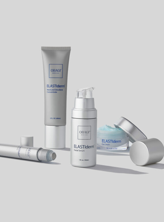 A set of five sleek skincare products arranged on a plain background.