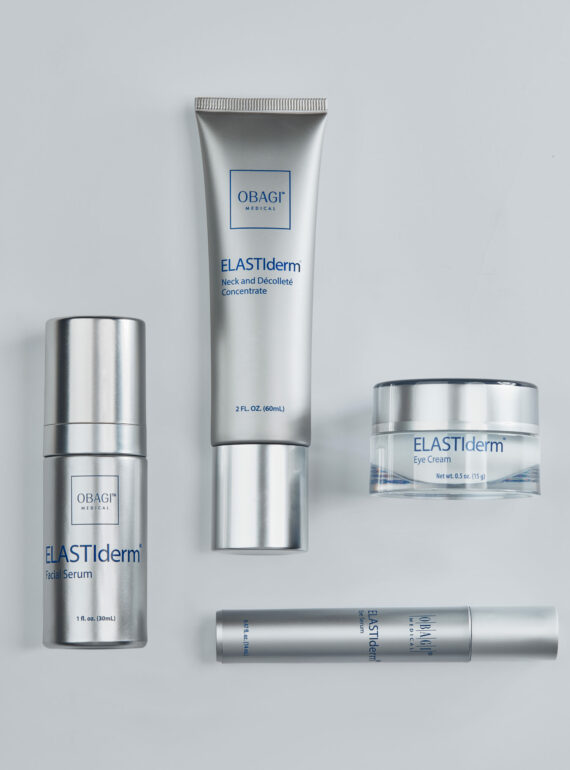 Four sleek silver skincare products on a white background.