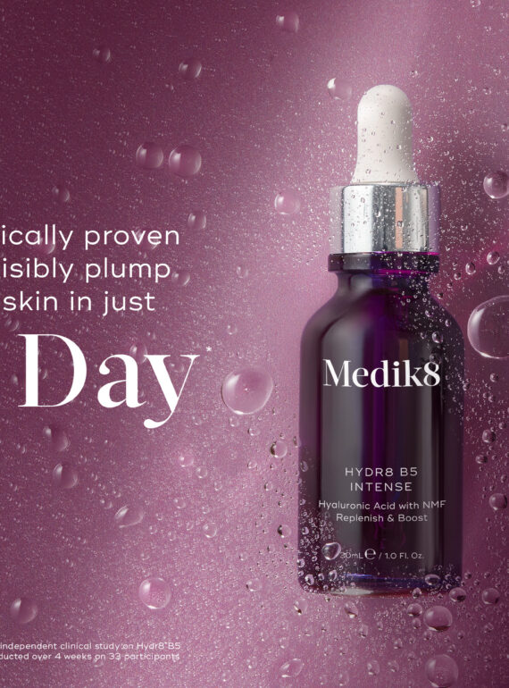 Medik8 serum bottle with water droplets for hydration.