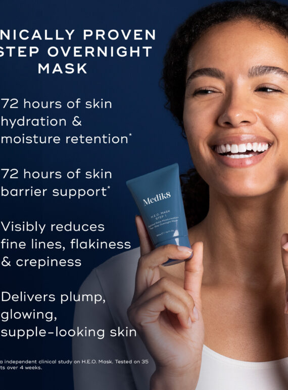 Smiling woman promoting a clinically proven 2-step overnight skincare mask.