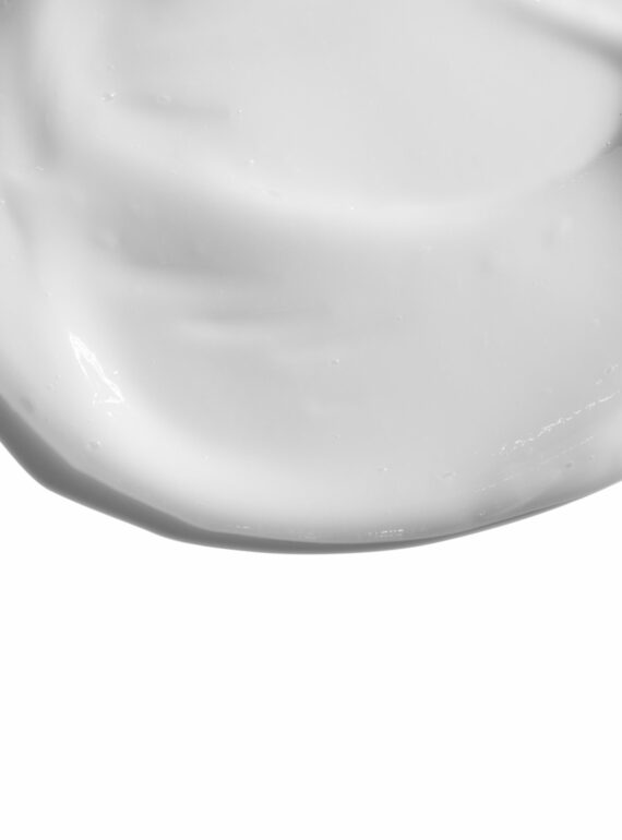 Smooth white cream texture on a white background.