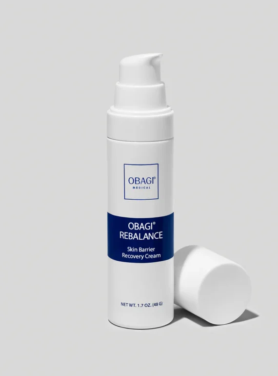 A white pump bottle of skin treatment serum with a blue label.