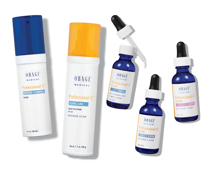 Skincare bottles and droppers arranged neatly on a white surface.